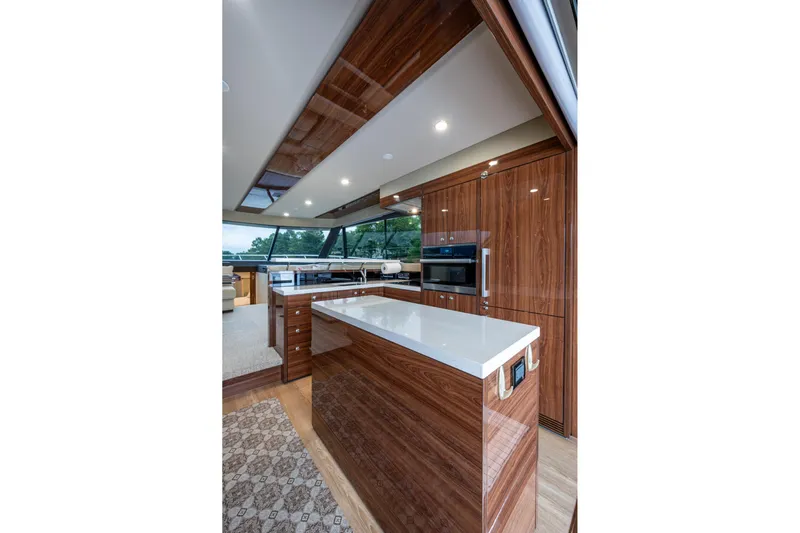 Norfolk Girl Yacht Photos Pics Luxurious interior of 2023 Maritimo M55 yacht with modern kitchen design.