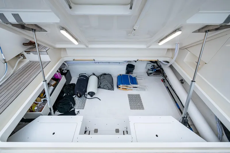 Norfolk Girl Yacht Photos Pics 2023 Maritimo M55 yacht storage area with equipment and supplies neatly organized.