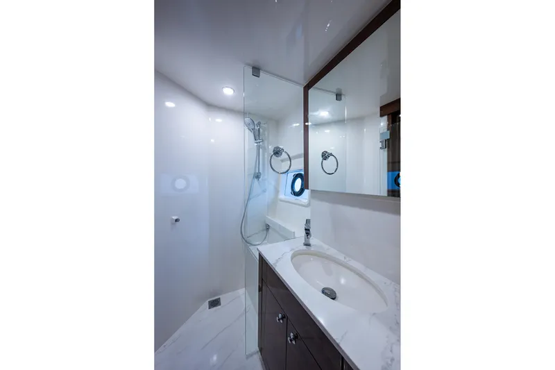 Norfolk Girl Yacht Photos Pics Luxurious bathroom in 2023 Maritimo M55 yacht with modern fixtures and elegant design.