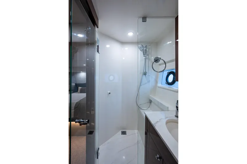 Norfolk Girl Yacht Photos Pics Luxurious bathroom in 2023 Maritimo M55 yacht with modern shower and sleek design.