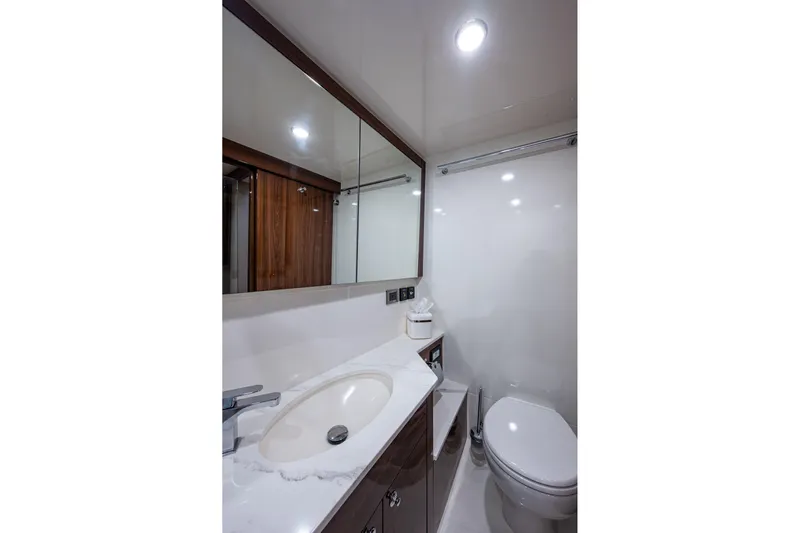 Norfolk Girl Yacht Photos Pics Luxurious bathroom in 2023 Maritimo M55 yacht with modern fixtures and elegant design.