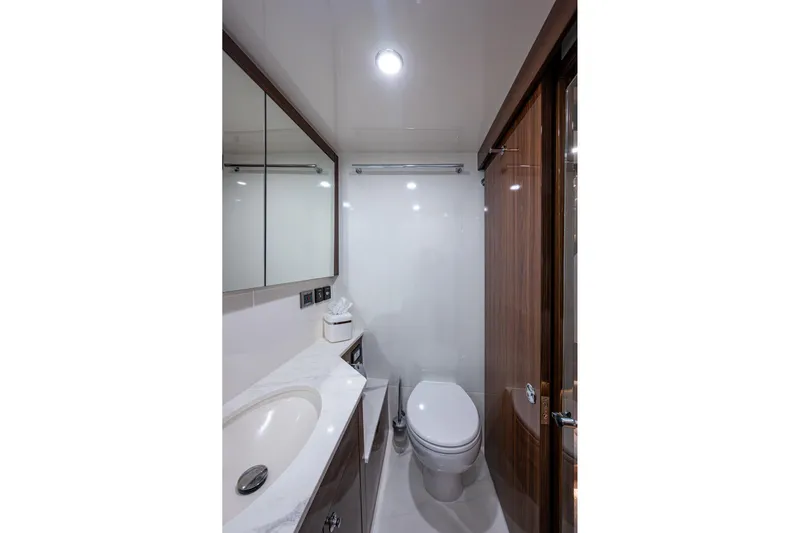 Norfolk Girl Yacht Photos Pics Luxurious bathroom in 2023 Maritimo M55 yacht, featuring modern fixtures and elegant design.