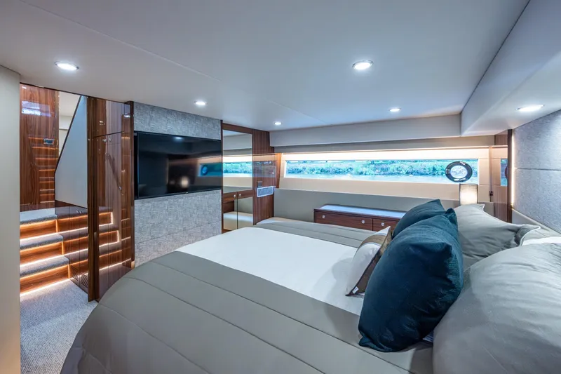 Norfolk Girl Yacht Photos Pics Luxurious interior of 2023 Maritimo M55 yacht with elegant bedroom design.