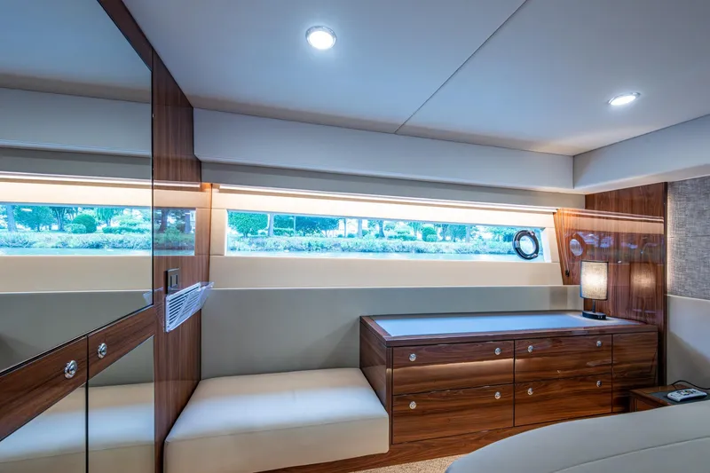 Norfolk Girl Yacht Photos Pics Luxurious interior of 2023 Maritimo M55 yacht with elegant wood finishes and modern lighting.