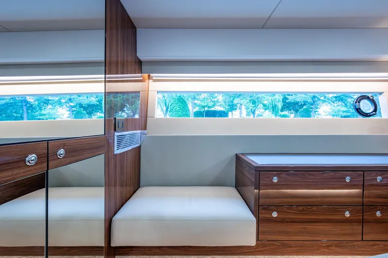 Norfolk Girl Yacht Photos Pics Luxurious interior of 2023 Maritimo M55 yacht with elegant wood finish and large window.