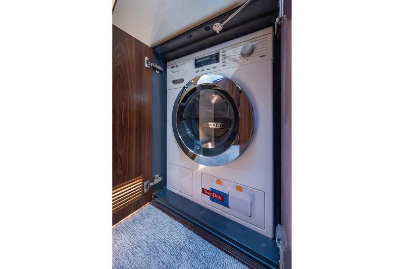 Norfolk Girl Yacht Photos Pics 2023 Maritimo M55 yacht interior with built-in washer-dryer unit.