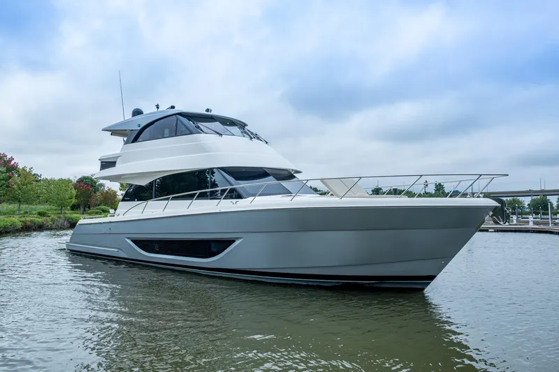Norfolk Girl Yacht Photos Pics 2023 Maritimo M55 yacht on calm water, showcasing sleek design and modern features.