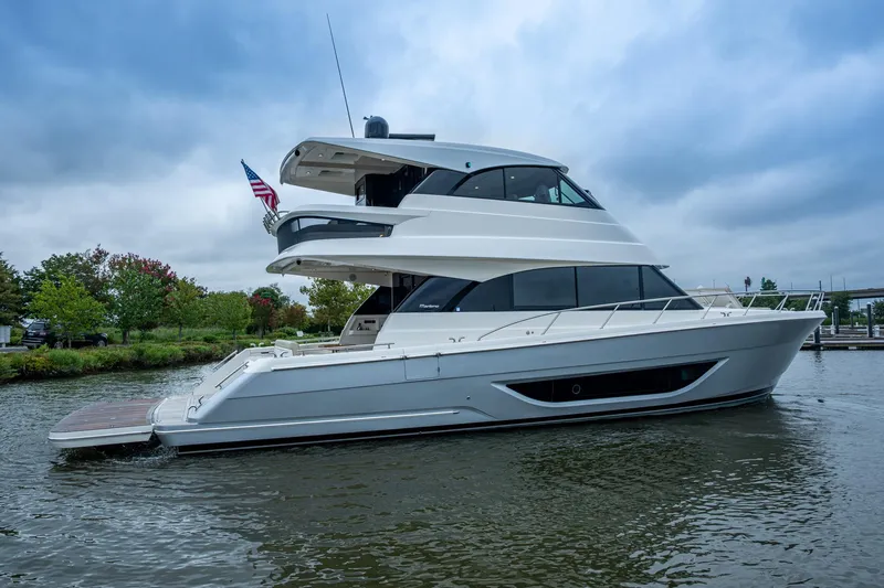 Norfolk Girl Yacht Photos Pics 2023 Maritimo M55 yacht on water, sleek design, overcast sky.