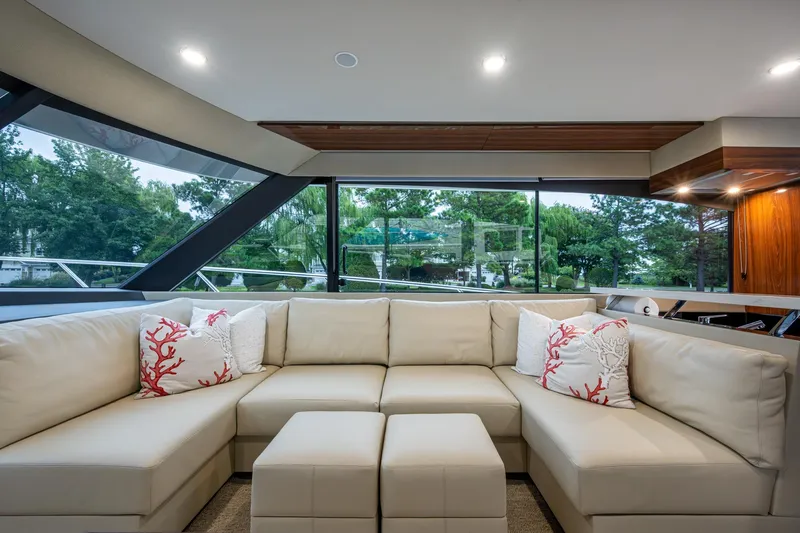 Norfolk Girl Yacht Photos Pics Luxurious interior of 2023 Maritimo M55 yacht with plush seating and scenic windows.