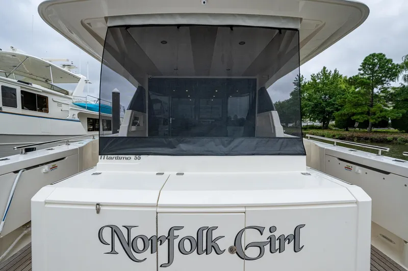 Norfolk Girl Yacht Photos Pics 2023 Maritimo M55 yacht "Norfolk Girl" docked, rear view with covered deck.