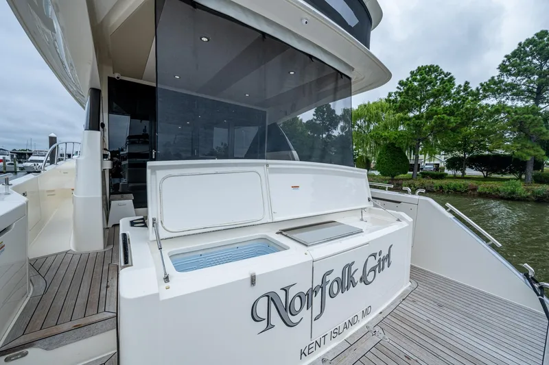 Norfolk Girl Yacht Photos Pics 2023 Maritimo M55 yacht docked, featuring spacious deck and elegant design.