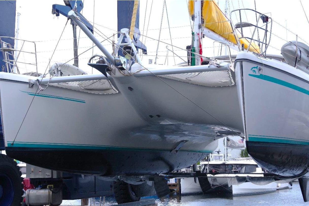 Catamaran Privilege 49, 2004 model, docked with visible hull and netting.