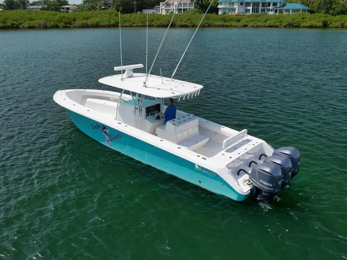 Baby Blues Yacht Photos Pics 2013 Bahama 37 boat on water with dual outboard engines.