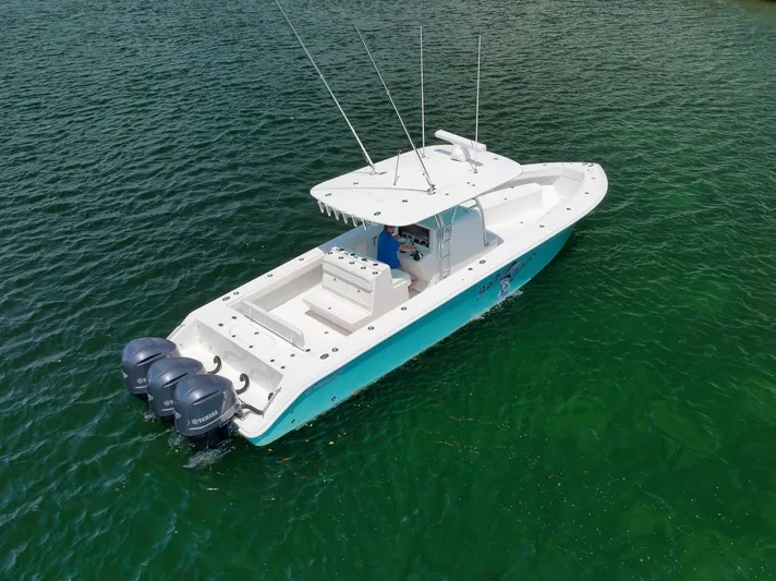 Baby Blues Yacht Photos Pics 2013 Bahama 37 boat with triple engines on clear water.