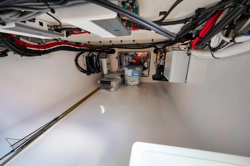 Baby Blues Yacht Photos Pics Interior view of a 2013 Bahama 37 boat's storage compartment with organized wiring and equipment.