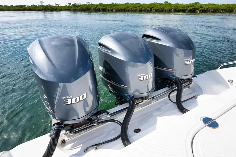 Baby Blues Yacht Photos Pics Triple Yamaha 300 outboard engines on a 2013 Bahama 37 boat in clear water.