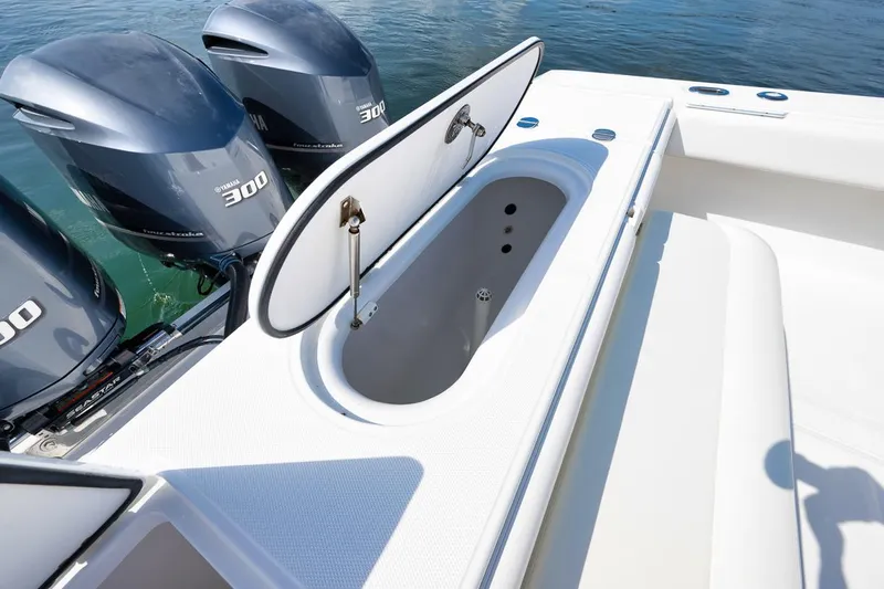 Baby Blues Yacht Photos Pics 2013 Bahama 37 boat with open storage compartment and triple 300 horsepower engines.