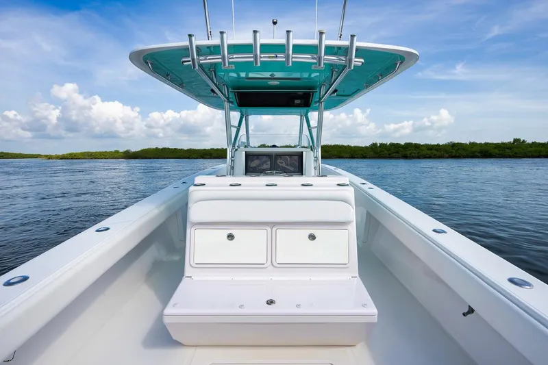 Baby Blues Yacht Photos Pics 2013 Bahama 37 boat on calm water, featuring a sleek design and spacious deck.