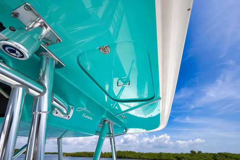 Baby Blues Yacht Photos Pics Turquoise 2013 Bahama 37 boat against a clear blue sky.