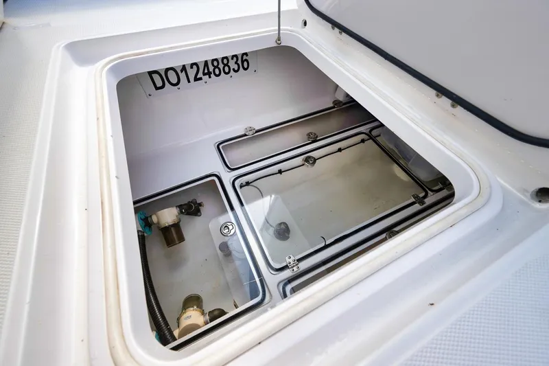 Baby Blues Yacht Photos Pics Open hatch of 2013 Bahama 37 boat showing storage compartment.