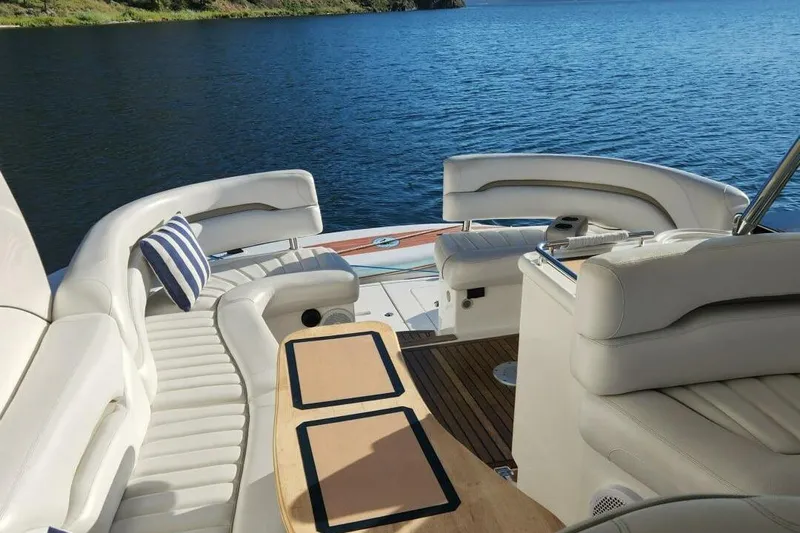  Yacht Photos Pics Luxurious 2005 Doral Alegria yacht interior with white seating and scenic water view.