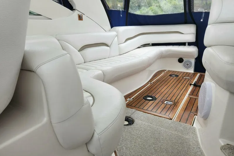  Yacht Photos Pics Luxurious interior of a 2005 Doral Alegria boat with white seating and wooden flooring.