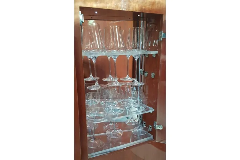  Yacht Photos Pics Glass cabinet in 2005 Doral Alegria yacht, showcasing elegant wine glasses.