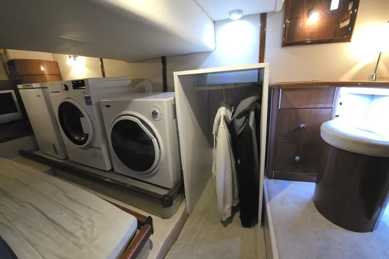  Yacht Photos Pics Interior of 2005 Doral Alegria yacht with laundry area and closet space.
