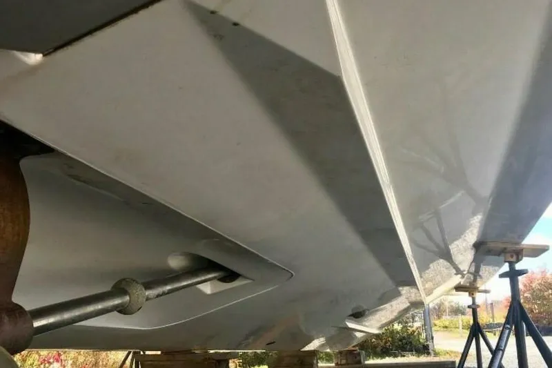  Yacht Photos Pics 2005 Doral Alegria boat hull on stands, showcasing underside and propeller shaft.