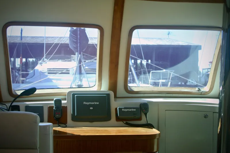 Que Sera Yacht Photos Pics Interior view of a 2009 Prout 45S yacht with navigation equipment.