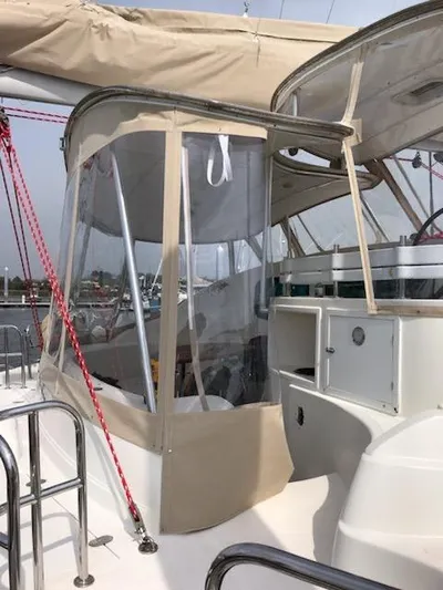 Que Sera Yacht Photos Pics 2009 Prout 45S yacht with beige canopy and clear panels in a marina setting.