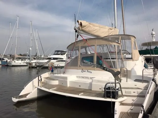Que Sera Yacht Photos Pics 2009 Prout 45S catamaran docked in a marina with other boats.