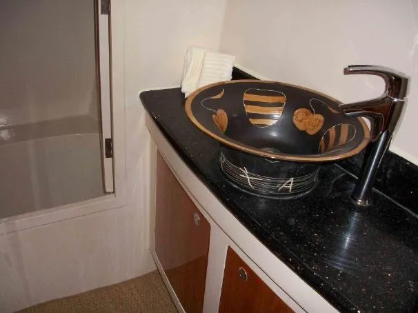 Que Sera Yacht Photos Pics Elegant bathroom sink with artistic bowl design on Prout 45S, 2009 model yacht.