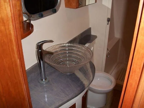 Que Sera Yacht Photos Pics Luxurious bathroom in 2009 Prout 45S yacht with glass sink and modern fixtures.