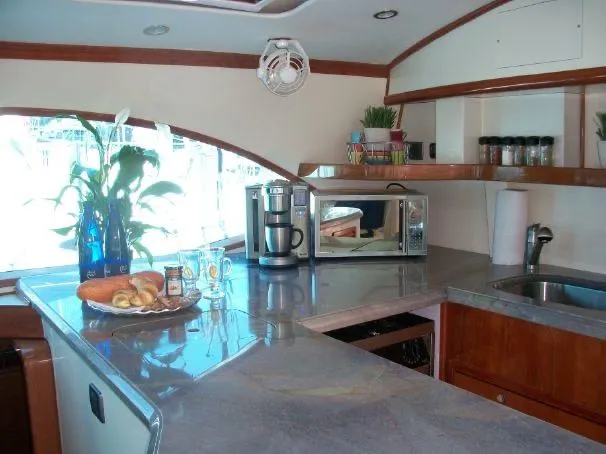 Que Sera Yacht Photos Pics Modern kitchen interior on 2009 Prout 45S yacht with appliances and decor.