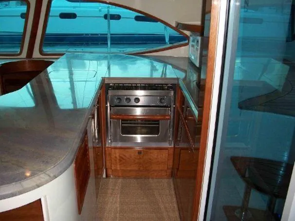 Que Sera Yacht Photos Pics Interior of 2009 Prout 45S yacht kitchen with modern appliances and sleek design.