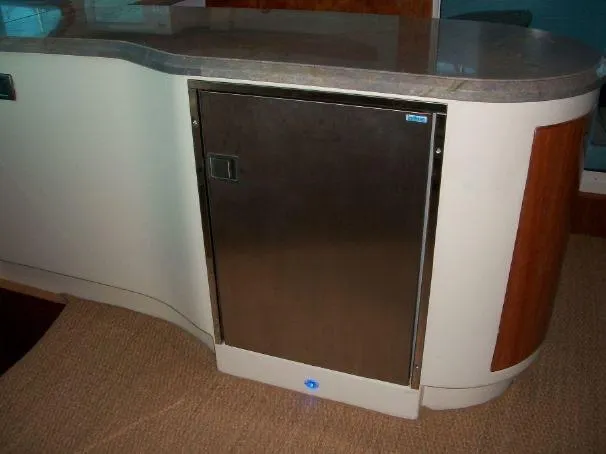 Que Sera Yacht Photos Pics Modern kitchen area in a 2009 Prout 45S yacht, featuring sleek cabinetry and countertop.