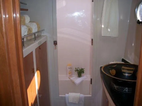 Que Sera Yacht Photos Pics Luxurious bathroom in 2009 Prout 45S yacht with modern fixtures and elegant decor.