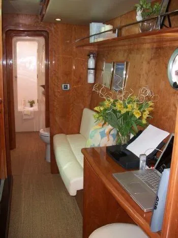 Que Sera Yacht Photos Pics Luxurious interior of 2009 Prout 45S yacht with wood paneling and modern amenities.