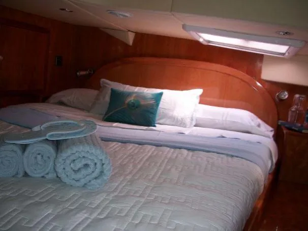 Que Sera Yacht Photos Pics Luxurious cabin interior of 2009 Prout 45S yacht with neatly arranged bedding.