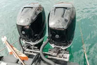 Twin outboard motors on a 2008 Fabio Buzzi FB 38/19 S boat in water.