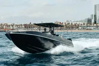 Speedboat Fabio Buzzi FB 38/19 S cruising on water, 2008 model, cityscape background.