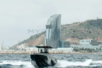 2008 FB Design Fabio Buzzi FB 38/19 S boat cruising near a coastal cityscape.