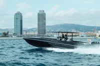 High-speed Fabio Buzzi FB 38/19 S boat cruising near city skyline, 2008 model.