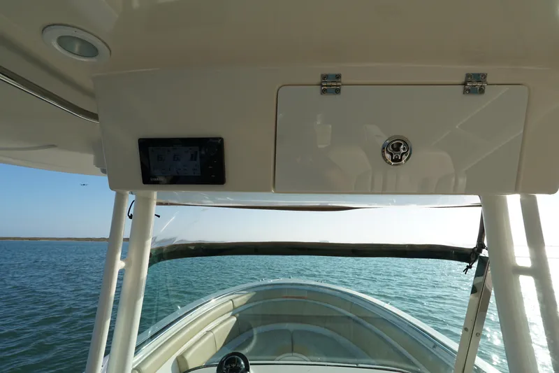  Yacht Photos Pics 2016 Pursuit ST 310 Sport boat interior view on open water.