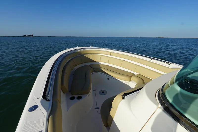  Yacht Photos Pics 2016 Pursuit ST 310 Sport boat with spacious seating on calm water.