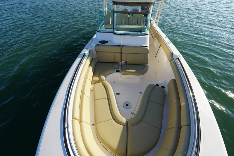  Yacht Photos Pics 2016 Pursuit ST 310 Sport boat with spacious seating on calm water.