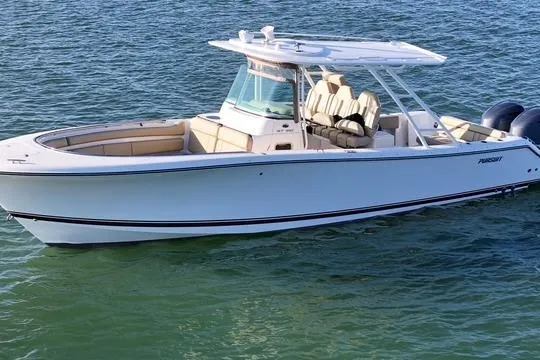  Yacht Photos Pics 2016 Pursuit ST 310 Sport boat on water, featuring sleek design and dual engines.