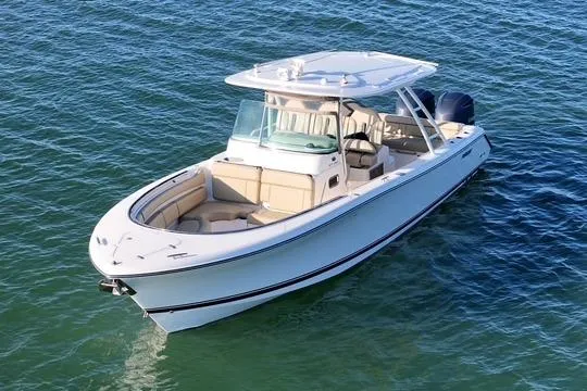  Yacht Photos Pics 2016 Pursuit ST 310 Sport boat on clear blue water.