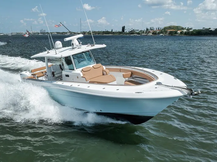 Mo Jack Yacht Photos Pics 2022 HCB Lujo boat cruising on a sunny day, showcasing sleek design and luxury features.